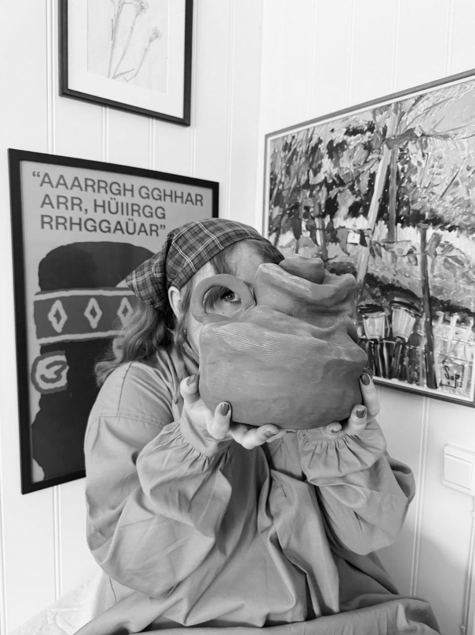 Me holding my work "Self-portrait"